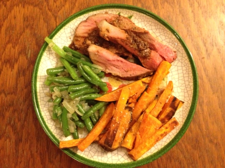 Roast beef with homemade sweet potato fries and green beans with onion.
